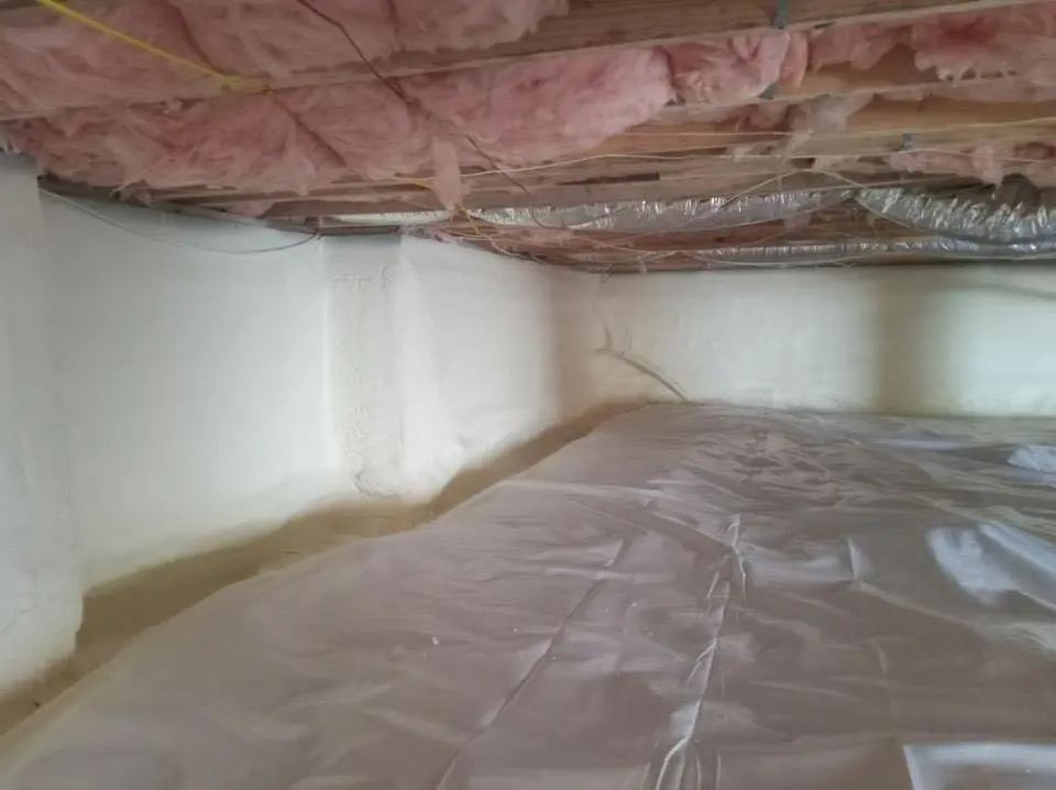 Crawl space encapsulation with closed-cell spray foam for Commercial Roof Restoration in Minden